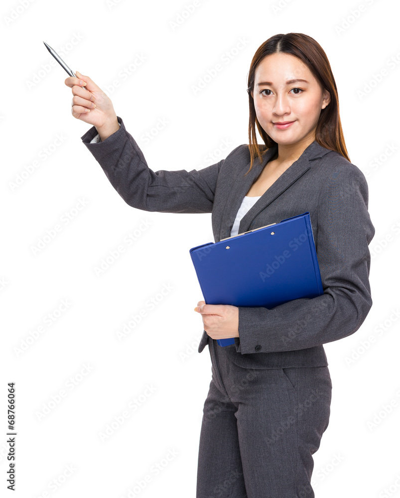 Asian businesswoman with clipboard and pen indicate something Asian businesswoman with clipboard and pen indicate something