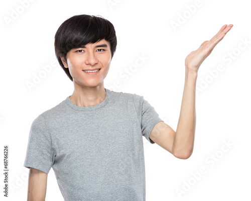 Asian young man with hand presentation