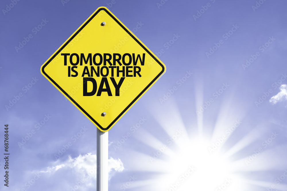Tomorrow is Another Day road sign with sun background Tomorrow is Another Day road sign with sun background