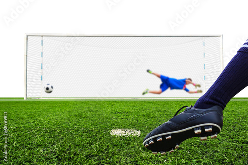 foot shooting soccer ball to goal, penalty