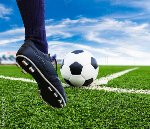 foot kicking soccer ball