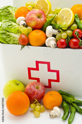 Fototapeta Naklejka Na Ścianę i Meble -  Healthy food. First aid box filled with fruits and vegetables.