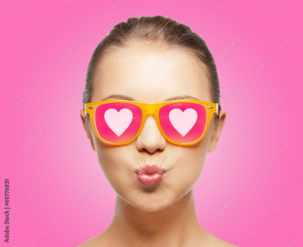 girl in pink sunglasses blowing kiss girl in pink sunglasses blowing kiss