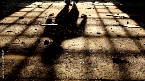 shadow of a man walking photo