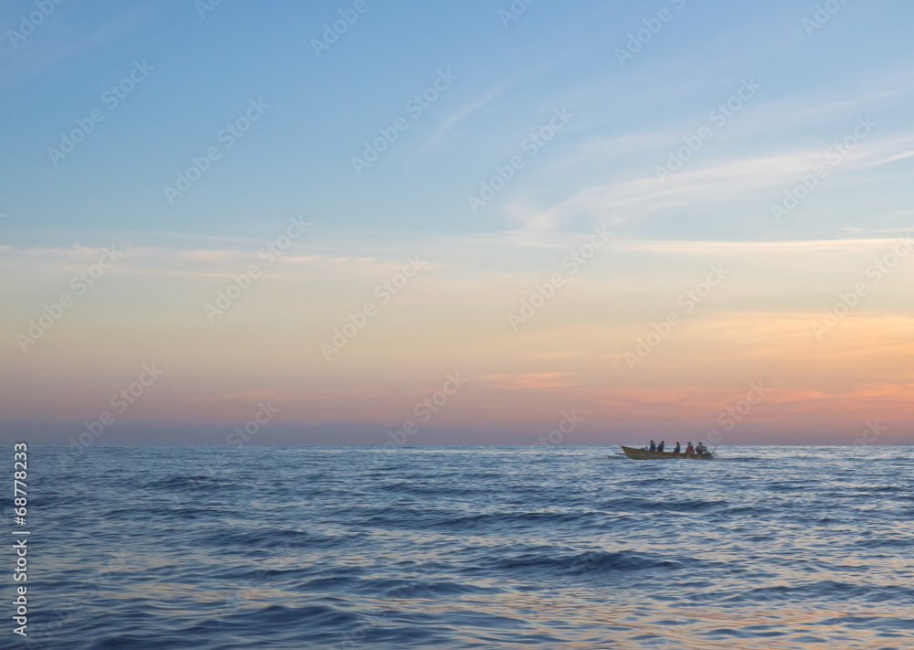 Morning seascape with a sailing small passengers boat