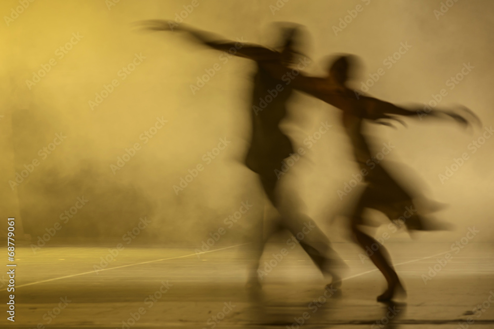 Group of contemporary dancers performing on stage