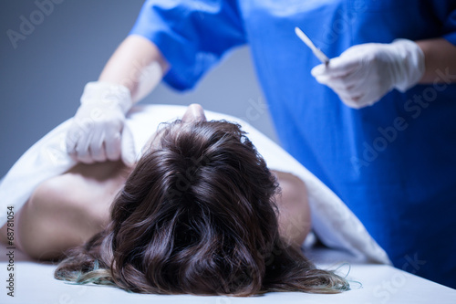 Dead woman lying in mortuary photo