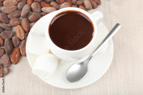 Cup of hot chocolate on table, close up