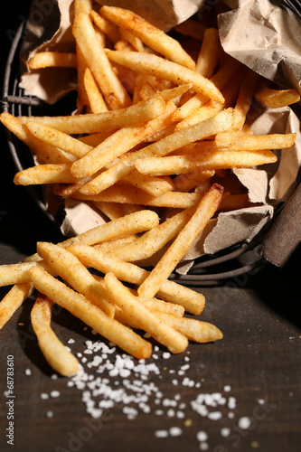 Obraz na plátně Tasty french fries in metal basket