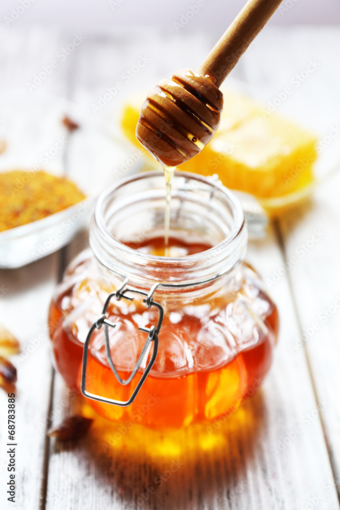 Fresh honey on wooden table Fresh honey on wooden table