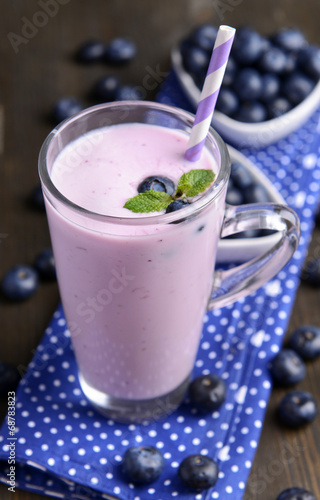 Delicious dessert with blueberries on table close-up