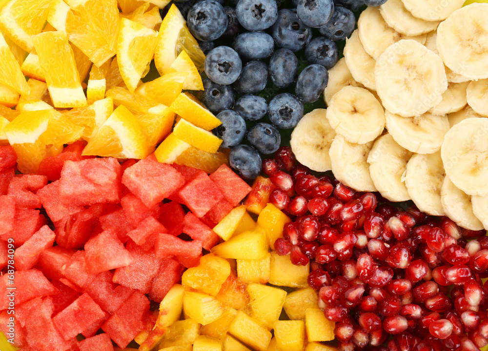 Sliced fruits on plate, close up Sliced fruits on plate, close up