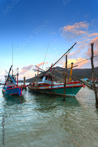 wooden fishing boats, water, sunset