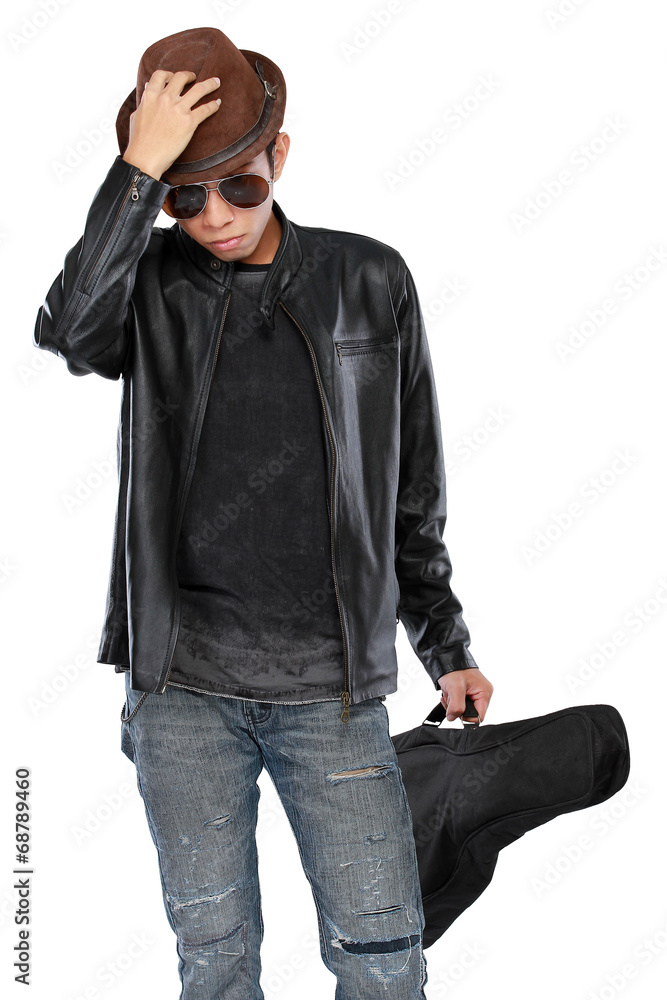 man in leather jacket holding a guitar man in leather jacket holding a guitar