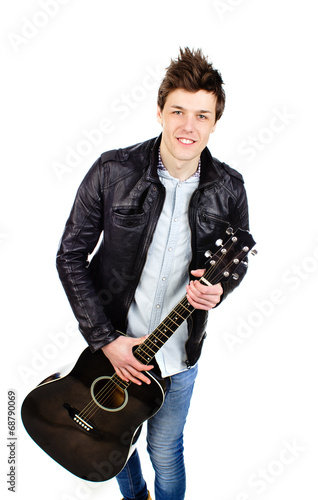 man in a leather jacket with a guitar