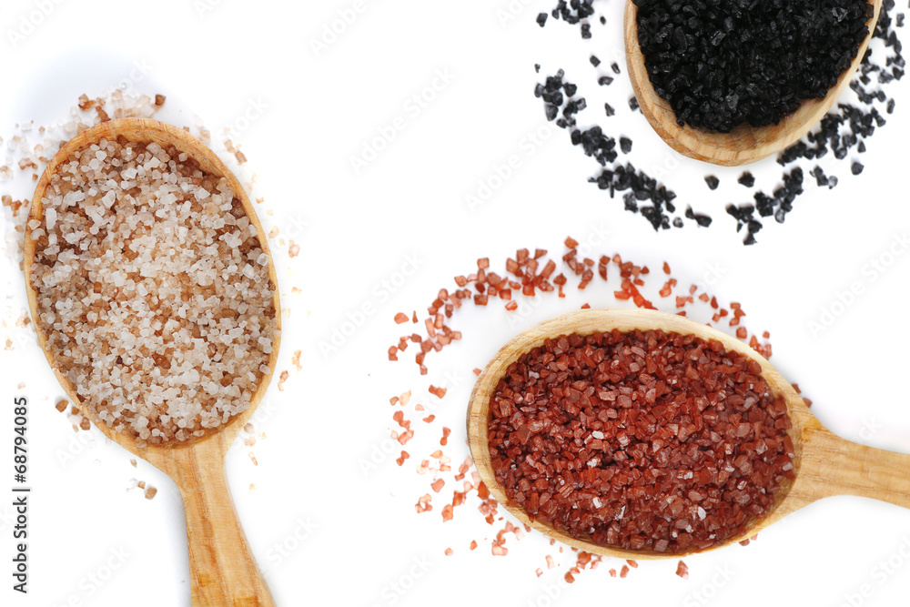 Different sea salt in wooden spoons, close up Different sea salt in wooden spoons, close up