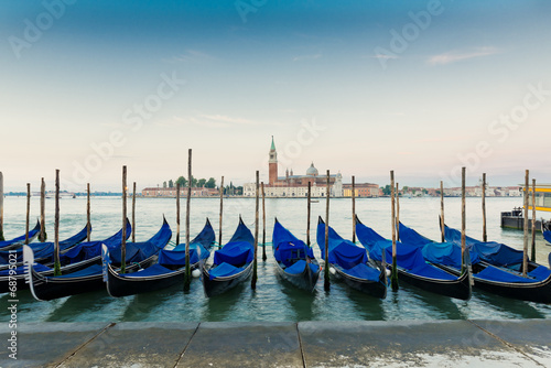 Gondolas moored by Saint Mark square with San Giorgio di Maggior © Valeri Luzina