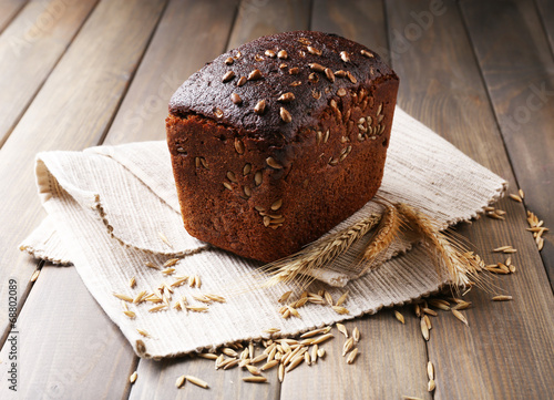 Fresh bread on wooden table, close up