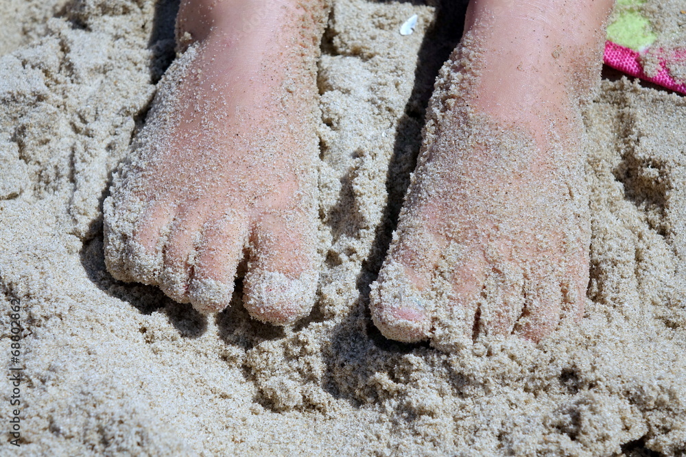 Obraz premium Füße im Sand