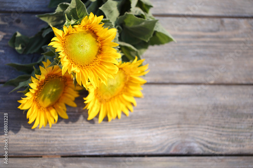 Fototapeta Naklejka Na Ścianę i Meble -  Beautiful sunflowers on table close-up
