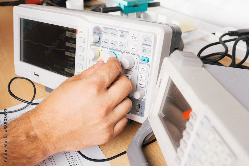 Tech tests electronic equipment in service Tech tests electronic equipment in service