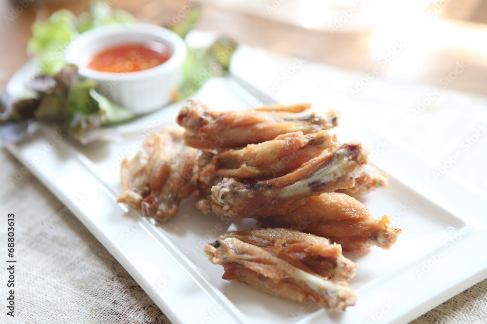 Fried chicken on wood background