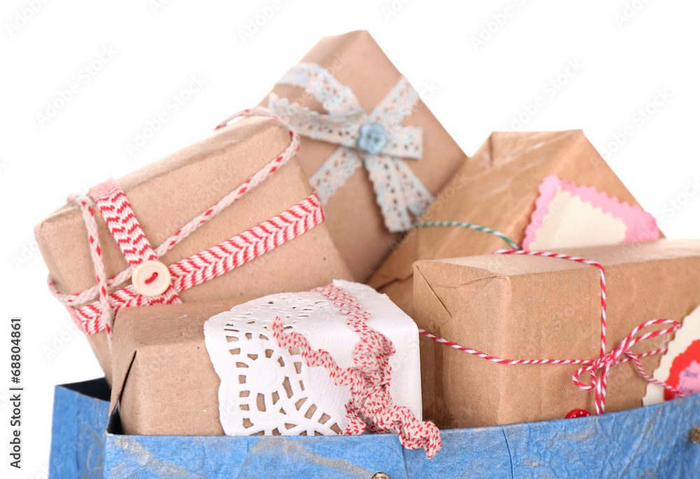 Present boxes in paper bag isolated on white Present boxes in paper bag isolated on white