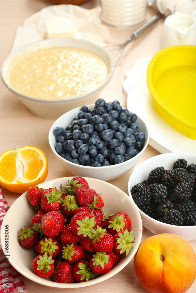 Baking tasty pie and ingredients for it on table in kitchen Baking tasty pie and ingredients for it on table in kitchen