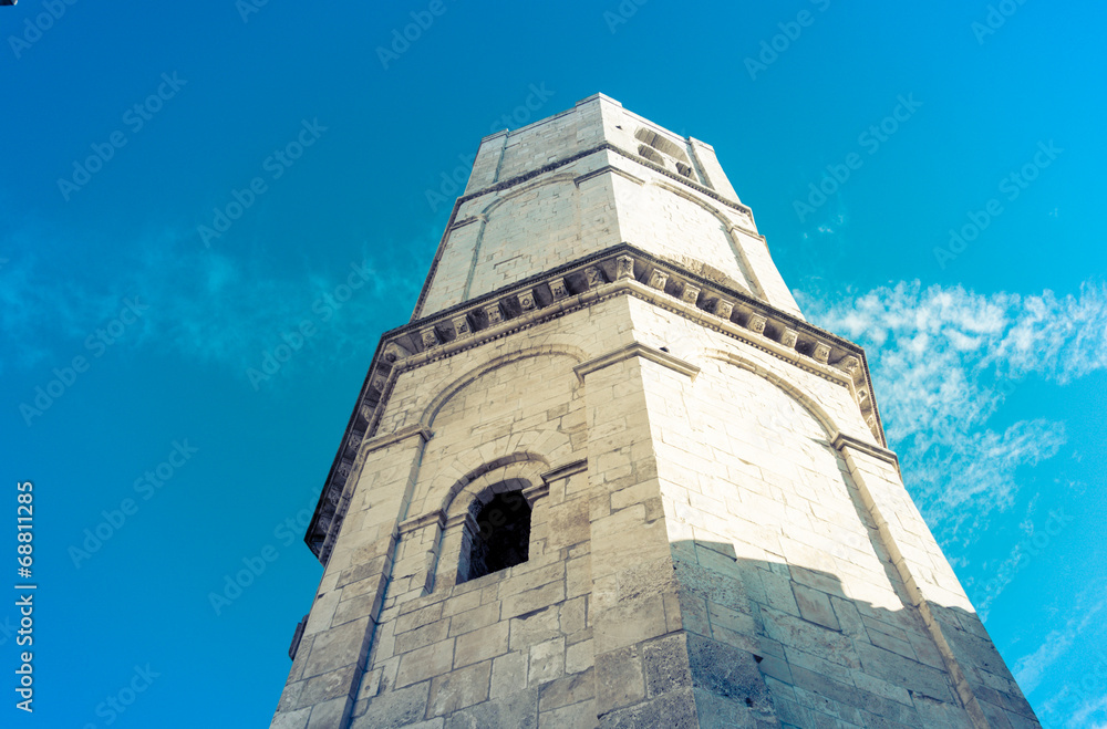 Obraz premium The old tower is looking at the sky