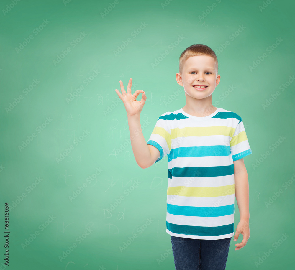 little boy in casual clothes making OK gesture little boy in casual clothes making OK gesture
