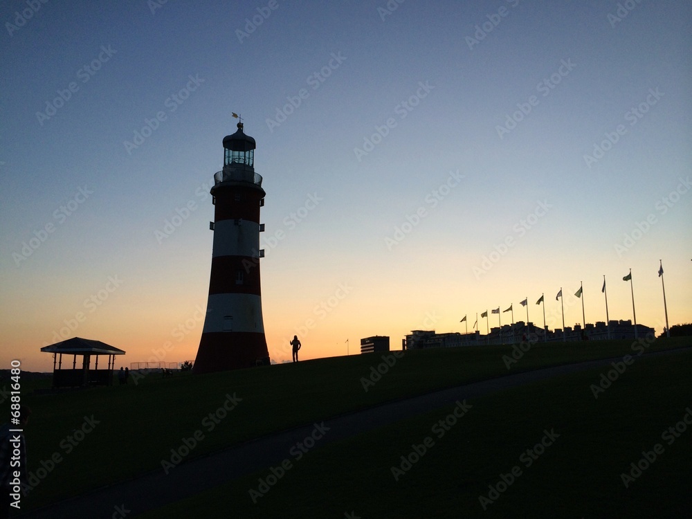 lighthouse tower at sunset in plymouth england