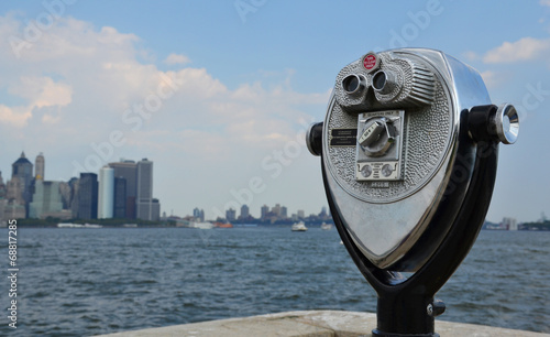 A coin-operated binocular viewer