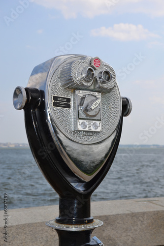 A coin-operated binocular viewer