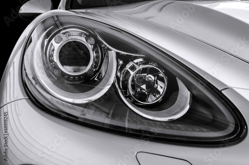 Closeup headlights of car. © alexdemeshko