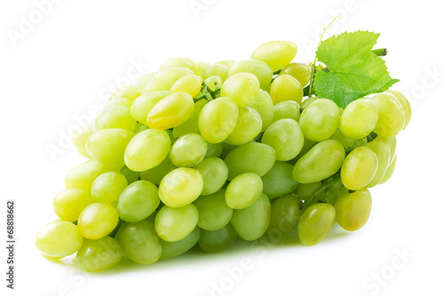 Fresh green grapes with leaves.