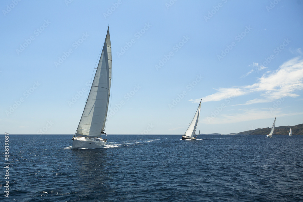 Sailing yacht on the race in a sea.