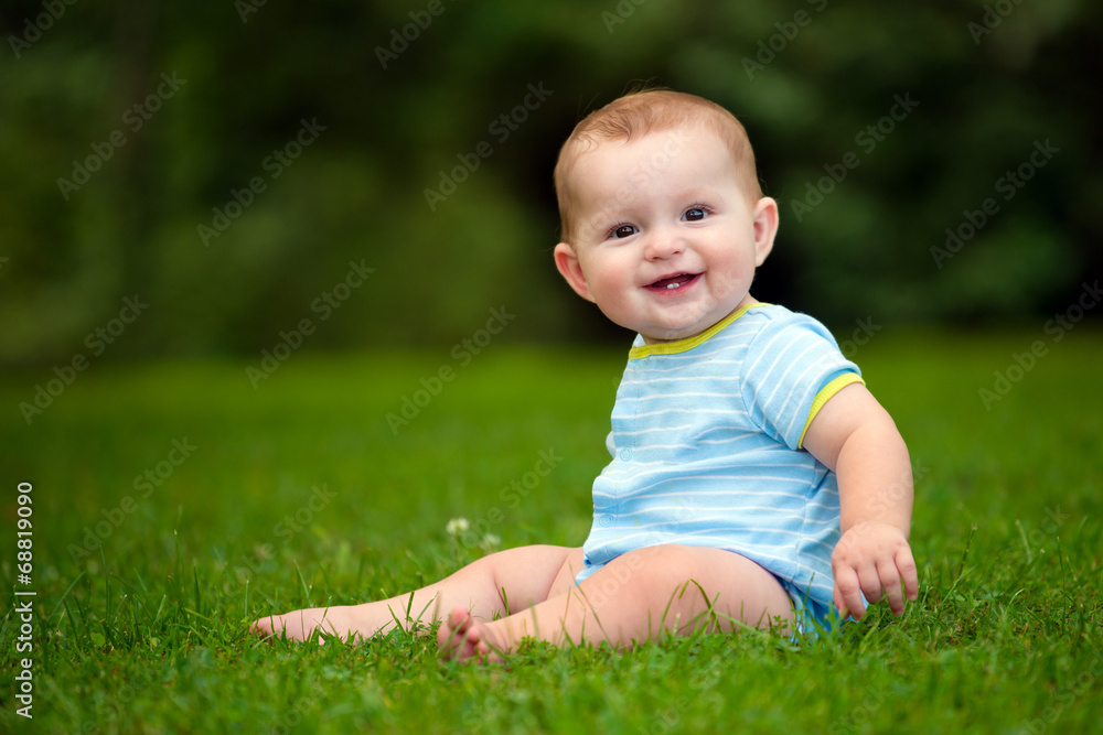 Summer portrait of happy baby boy infant outdoors at park Summer portrait of happy baby boy infant outdoors at park