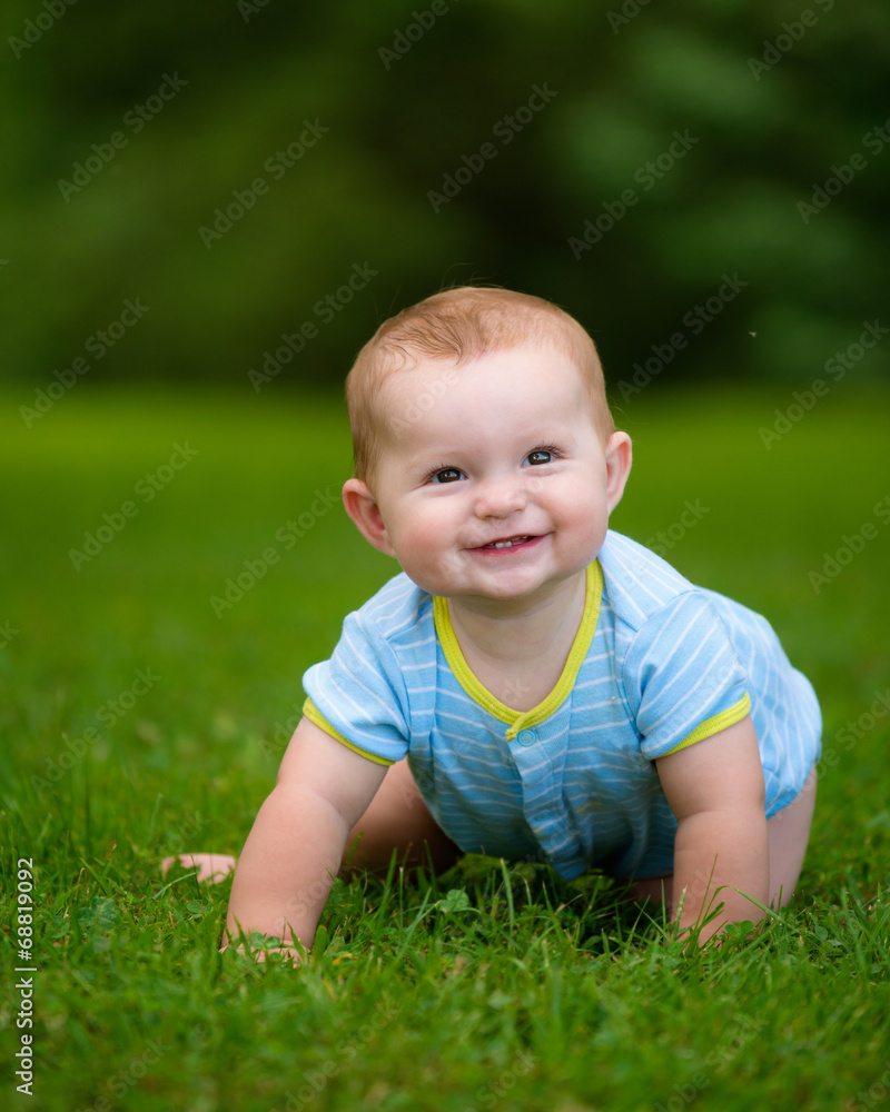 Summer portrait of happy baby boy infant outdoors at park Summer portrait of happy baby boy infant outdoors at park