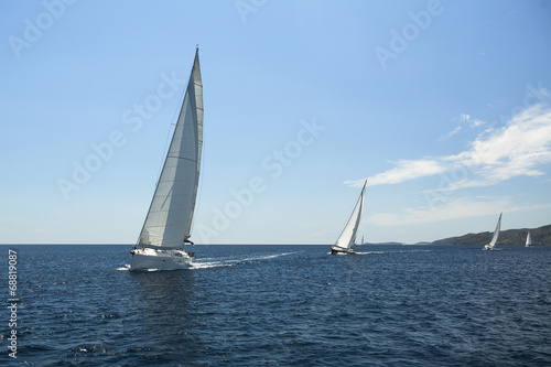 Sailing yacht on the race in a sea.