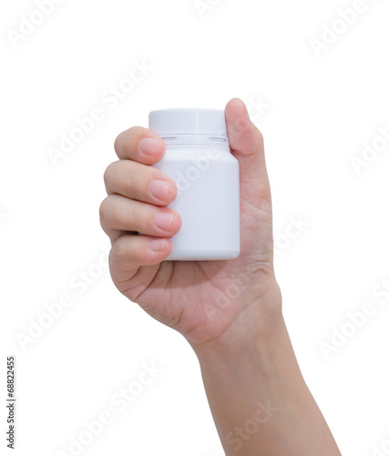 Pill bottle on hand isolated on white background