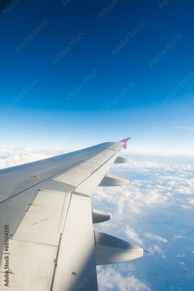 Airplane wing out of window Airplane wing out of window
