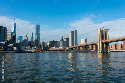 Brooklyn bridge in New York on bright summer day © Elnur
