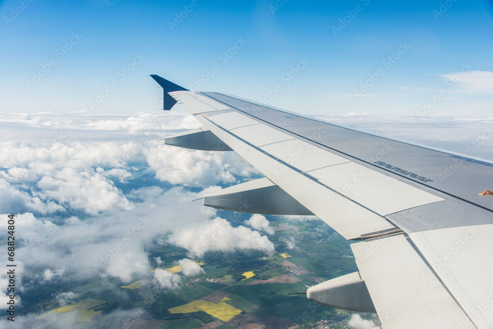 Airplane wing out of window Airplane wing out of window