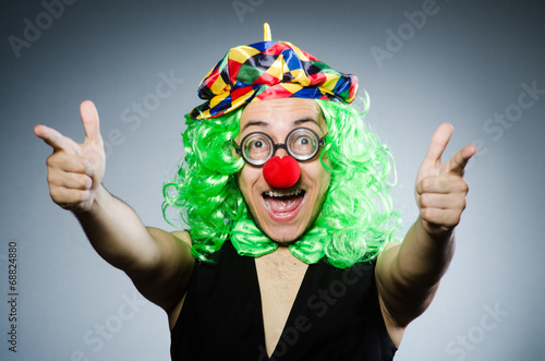 Funny clown against the dark background