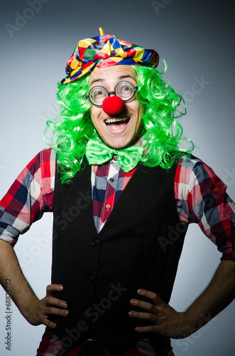 Funny clown against the dark background © Elnur