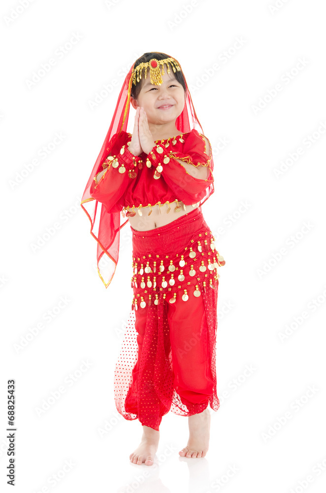 Little girl in traditional indian costume, saree and dancing