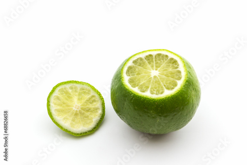 Fresh limes, cross section showing the limes skin.