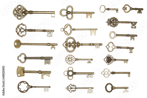 Golden keys isolated on white