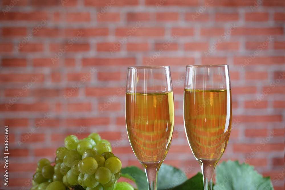 Grapes and two glasses of the white wine Grapes and two glasses of the white wine