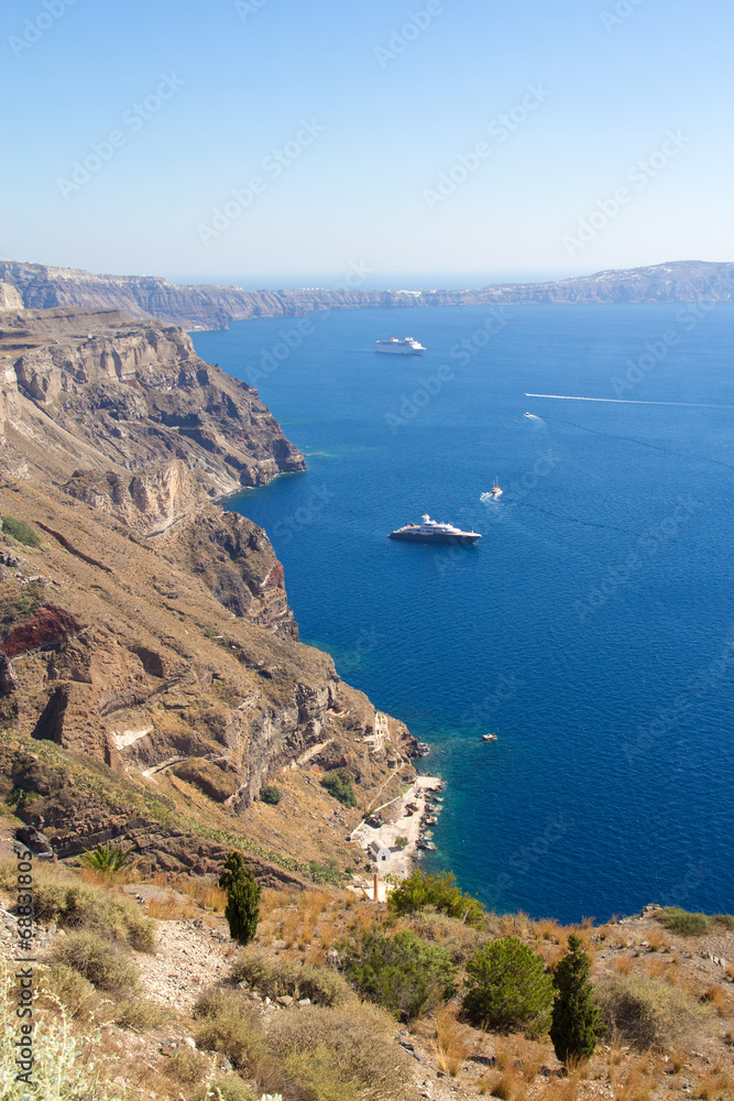 luxurious yachts and cruise ships in Santorini bay
